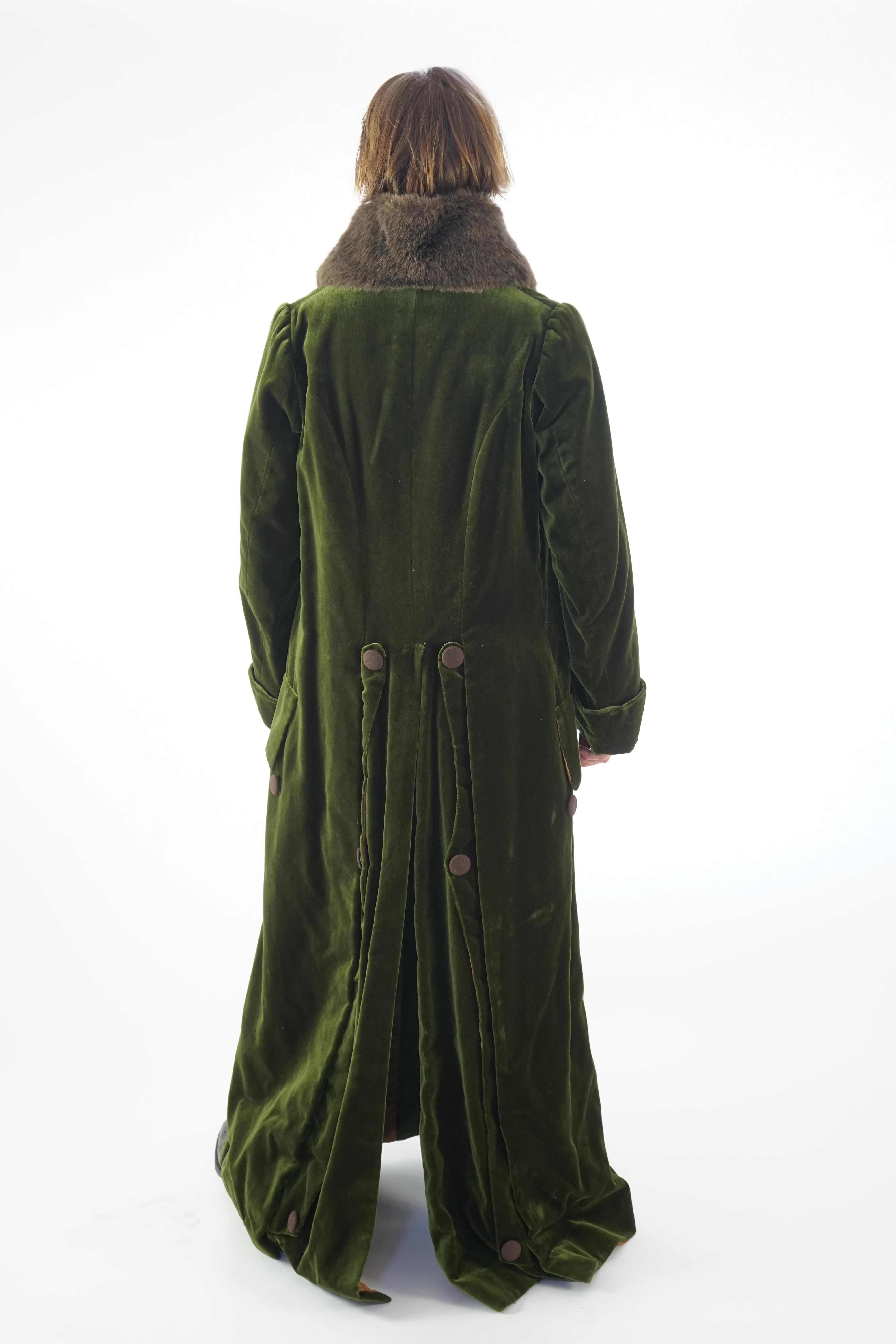 A gentleman's Regency style overcoat - bottle green with brown trim and fur (fake) collar. Ex Carl Rosa Opera Company 'Don Giovanni' and 'The Merry Widow'